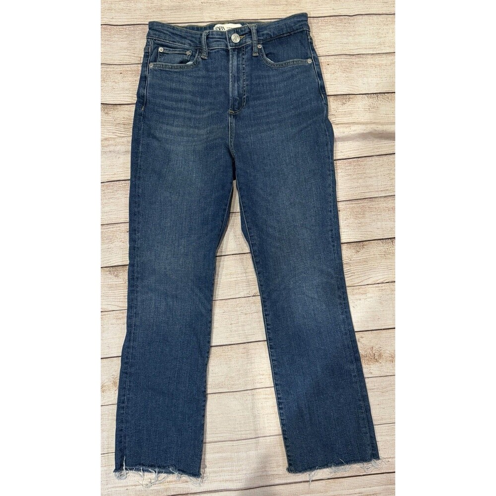 Zara high-waisted, medium wash jeans with a distinct raw Hem Size 4